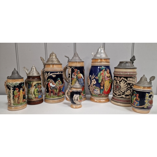 165 - A collection of eight vintage, lidded beer steins. Tallest 25cm.