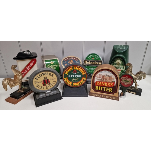 168 - A collection of branded beer pump signs. To include eight light-up examples. Untested. Tallest 25cm.