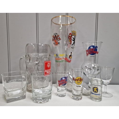 175 - A large collection of approximately one hundred branded pub glassware.