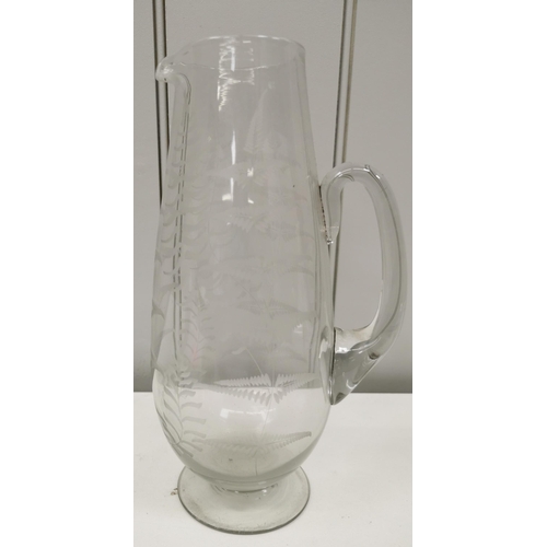 198 - A (likely) Victorian, tall, etched-glass pitcher. Height 27cm.