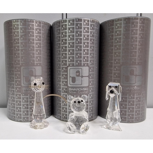 223 - Three pieces of boxed 'Swarovski' crystal art. To include cat, dog & teddy bear. Tallest 7.5cm.