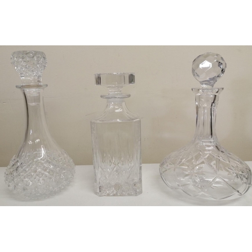 238 - A trio of heavy spirit & wine crystal decanters. Tallest item 28cm.