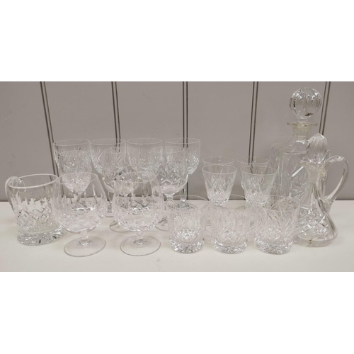 242 - A collection of crystal drinkware. To include two decanters & a selection of seventeen glasses.