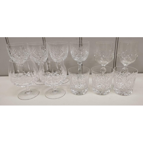 242 - A collection of crystal drinkware. To include two decanters & a selection of seventeen glasses.