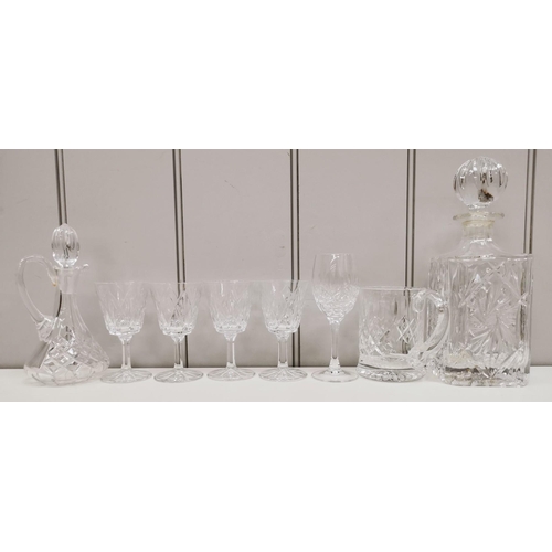 242 - A collection of crystal drinkware. To include two decanters & a selection of seventeen glasses.