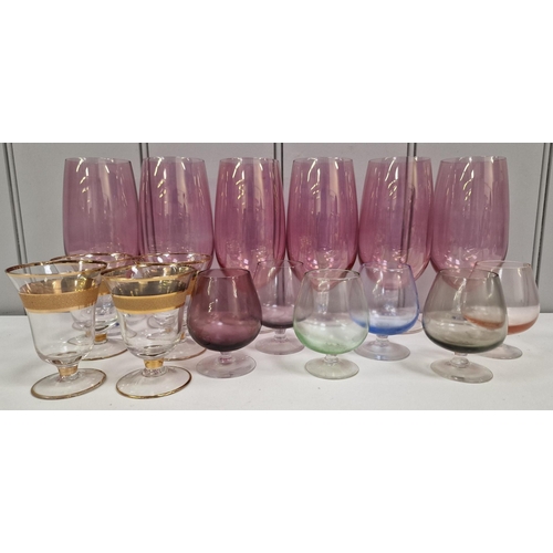 243 - A selection of retro, coloured drinking glasses. To include multi-coloured brandy glasses(x6), gold-... 