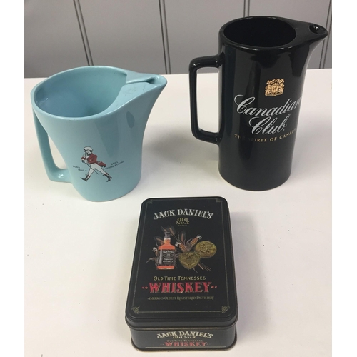 246 - Two branded water jugs & a collectible tin. To include 'Canadian Club', Johnnie Walker' & 'Jack Dani... 