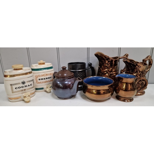 261 - A mixed selection of vintage items. To include a pair of ceramic dispensers, copper-effect pitchers ... 