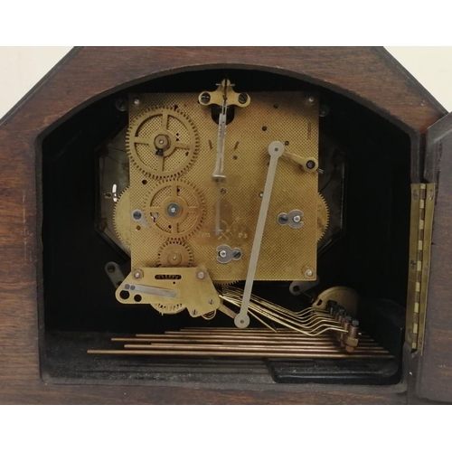 382 - A large, art-deco, oak-cased mantle clock. Adjustable levers for chime/silent and West/Whit. Appears... 