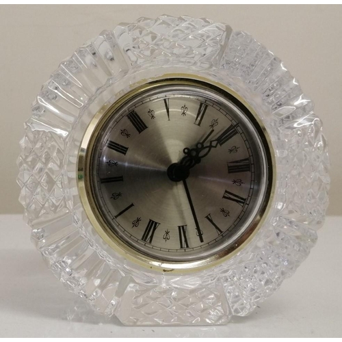 383 - A 'Tyrone Crystal' battery operated clock (10cm diameter) & a 'Concept' quartz flower-design table c... 