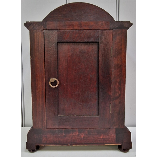 389 - An Edwardian mahogany inlaid mantle clock, with a brass bezel, circular dial, original hands & pilas... 