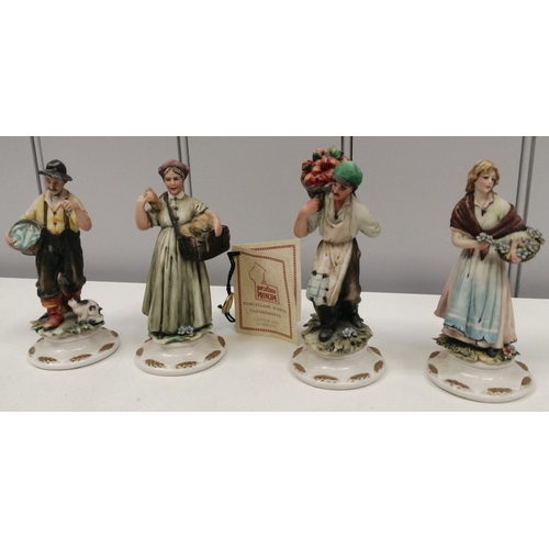 403 - A collection of four high quality, Capodimonte, street-seller figurines. Each 13cm tall.