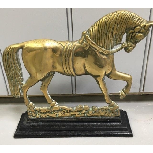 427 - A pair of 19th century, cast brass door stops. Each formed as a horse, on a stepped base. Dimensions... 