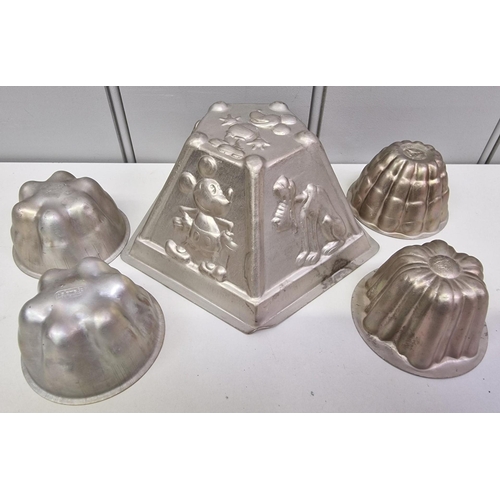 439 - A mixed lot of metal-based items. To include five vintage jelly moulds (including Disney), a trio of... 