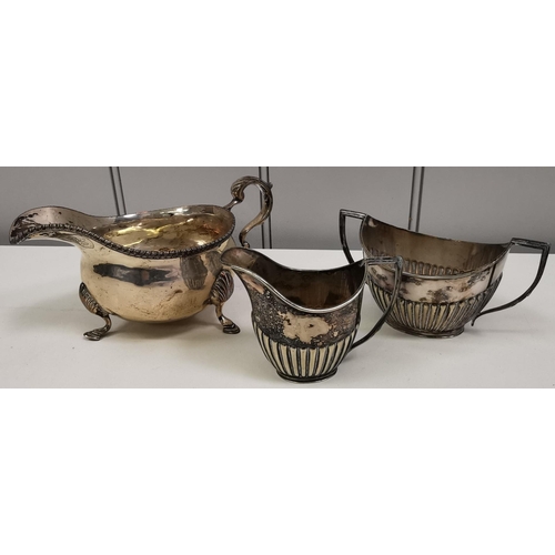 1267 - A selection of three pieces of silver-plated tableware. To include a sauce boat, creamer & twin-hand... 