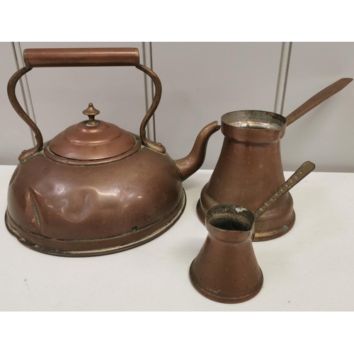 1290 - An antique copper kettle, together with two Turkish copper coffee pots. Respective dimensions(cm) H1... 