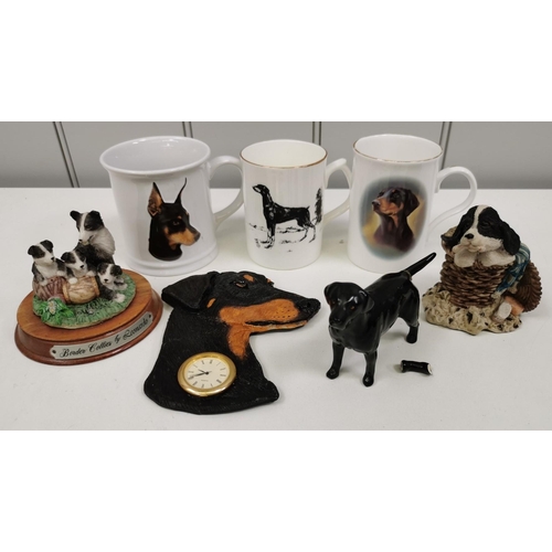 1336 - A collection of seven pieces of dog-related decorative items. To include a Beswick black Labrador (d... 