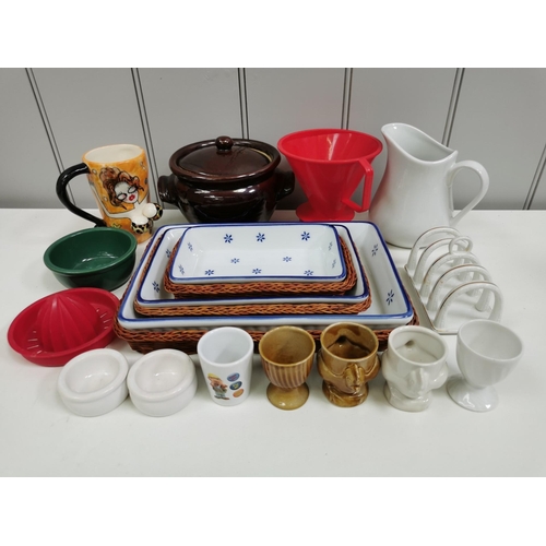 1341 - A selection of seventeen pieces of tableware. To include three graduated ceramic dishes in wicker ba... 