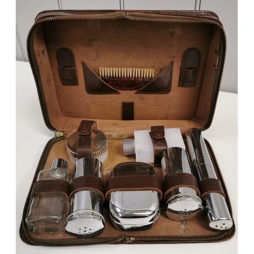 1441 - A vintage gentleman's grooming kit, with leather case.