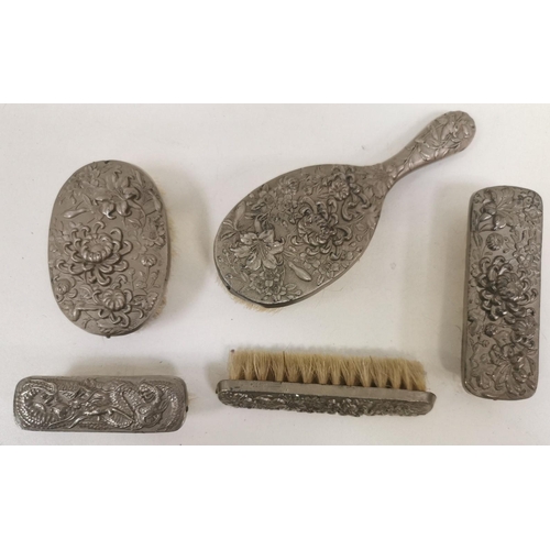 1486 - Vintage child's, white-metal backed, dressing table brush set. To include four matching & one simila... 