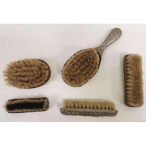 1486 - Vintage child's, white-metal backed, dressing table brush set. To include four matching & one simila... 