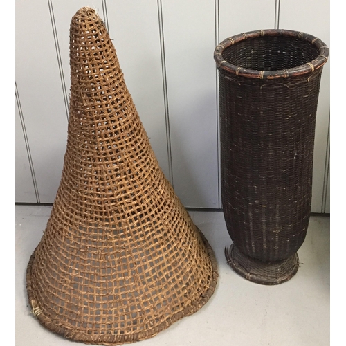 1492 - An antique woven fish trap, together with a wicker umbrella stand. Respective dimensions(cm) H76/62,... 