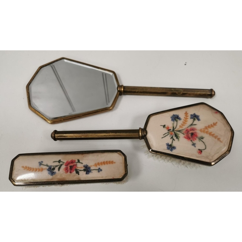 1509 - A vintage dressing table set. To include clothes brush, hairbrush & handheld mirror.