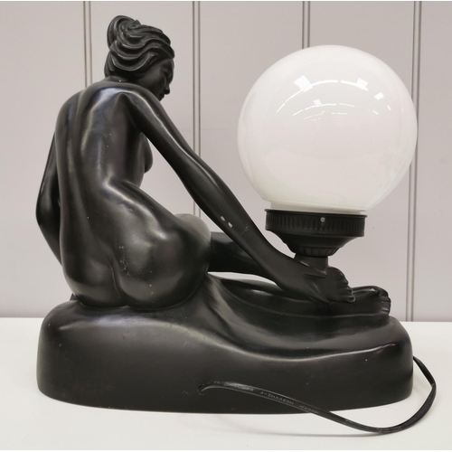 1546 - A figural table lamp. Features a reclining lady with large orb lamp. PAT Test pass & functionality t... 