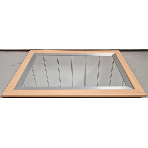 69 - A contemporary silver & beech coloured wall mirror. 68cm x 94cm.