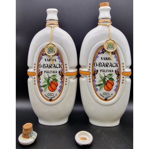 1102 - A pair of Hungarian ceramic liqueur flasks 'Varda O-Barack Palinka'. Height 25cm.