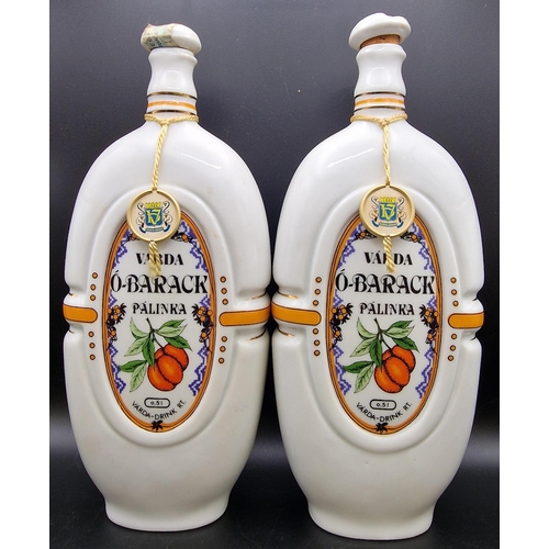 1102 - A pair of Hungarian ceramic liqueur flasks 'Varda O-Barack Palinka'. Height 25cm.