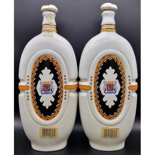 1102 - A pair of Hungarian ceramic liqueur flasks 'Varda O-Barack Palinka'. Height 25cm.