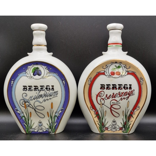 1103 - A trio of Hungarian ceramic liqueur flasks 'Beregi'. Height 20cm.