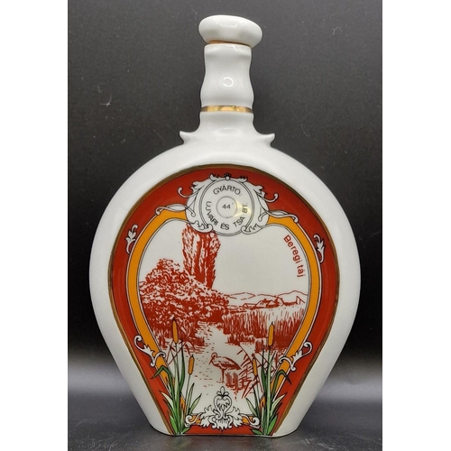 1103 - A trio of Hungarian ceramic liqueur flasks 'Beregi'. Height 20cm.