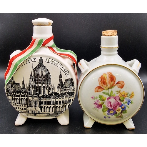 1104 - A mixed trio of traditional Hungarian ceramic liqueur flasks. Heights 20cm/16cm/14cm.