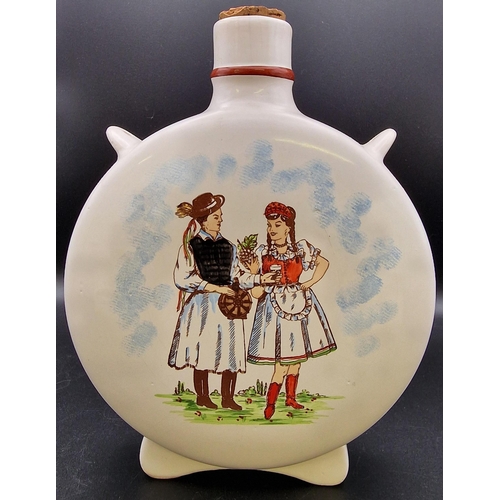 1104 - A mixed trio of traditional Hungarian ceramic liqueur flasks. Heights 20cm/16cm/14cm.