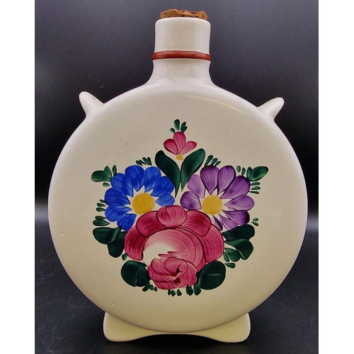 1104 - A mixed trio of traditional Hungarian ceramic liqueur flasks. Heights 20cm/16cm/14cm.