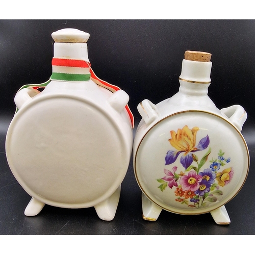 1104 - A mixed trio of traditional Hungarian ceramic liqueur flasks. Heights 20cm/16cm/14cm.