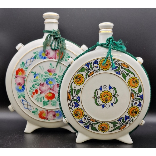 1105 - A pair of Hungarian ceramic liqueur flasks 'Hollohaza'. Heights 20cm/22cm.