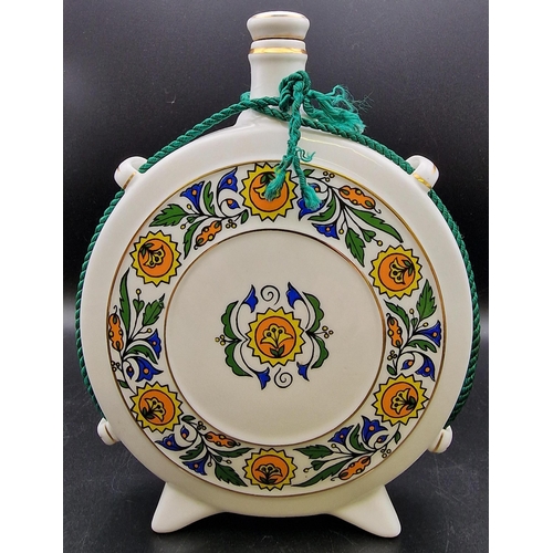 1105 - A pair of Hungarian ceramic liqueur flasks 'Hollohaza'. Heights 20cm/22cm.