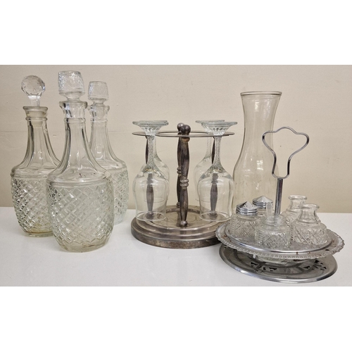 240 - A selection of vintage glass tableware. To include three decanters , a set of four wine glasses with... 