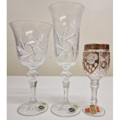 241 - A set of twenty-four 'Bohemia Crystal' glasses, together with another set of four decorate dlead cry... 