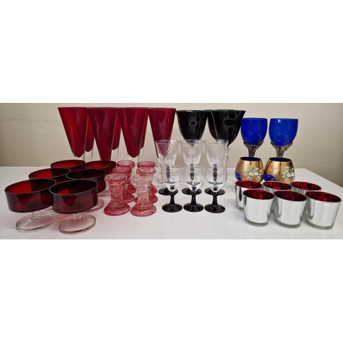 244 - A collection of several sets of vintage coloured glassware. To include a variety of drinking glasses... 