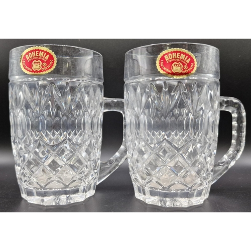 256 - A pair of Bohemia lead crystal mugs.