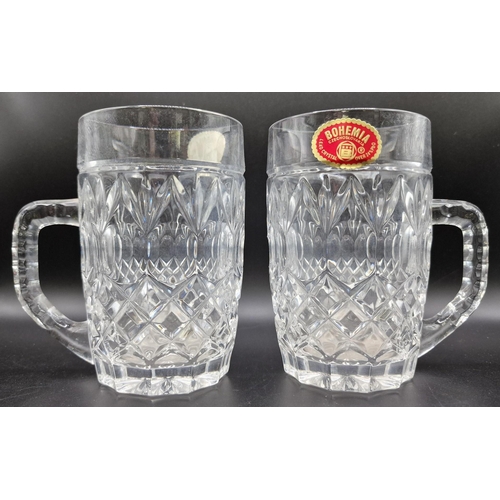 256 - A pair of Bohemia lead crystal mugs.