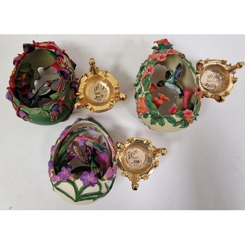 462 - A collection of seven 'House of Faberge' decorated & plinthed, bird-enclosed eggs