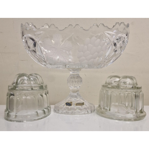 124 - A beautiful crystal fruit bowl, together with a pair of vintage glass jelly moulds.