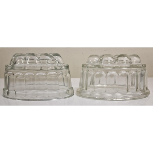 124 - A beautiful crystal fruit bowl, together with a pair of vintage glass jelly moulds.