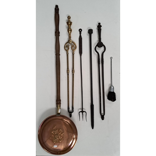 447 - An antique copper bedwarmer, together with a selection of fire irons.