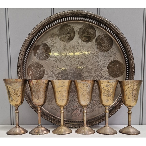 453 - A set of six brass goblets, together with a plated serving tray.